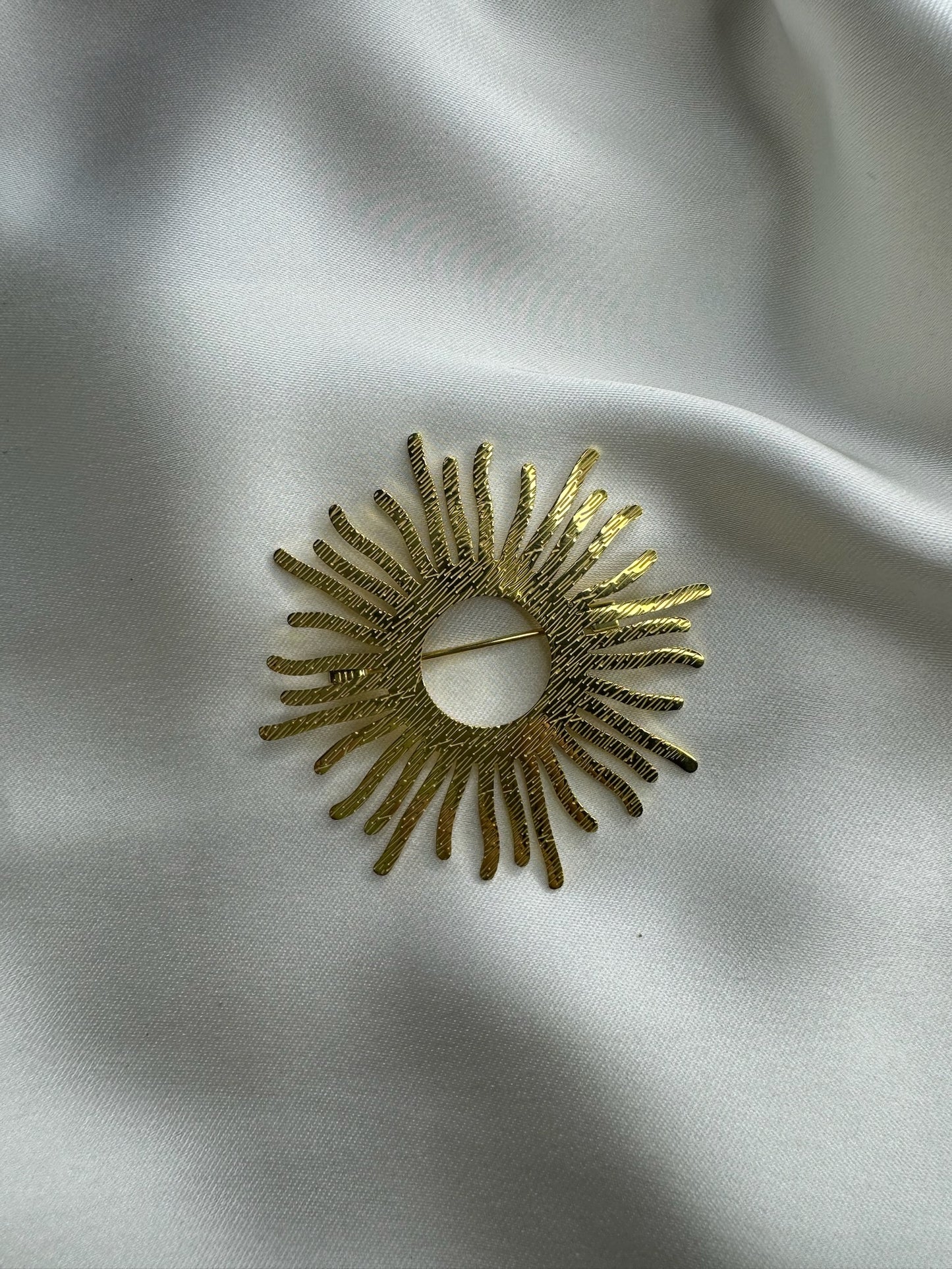 Broche soleil